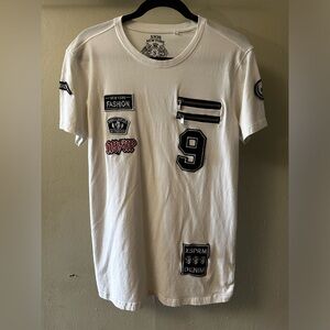 White tee with patches and zippers